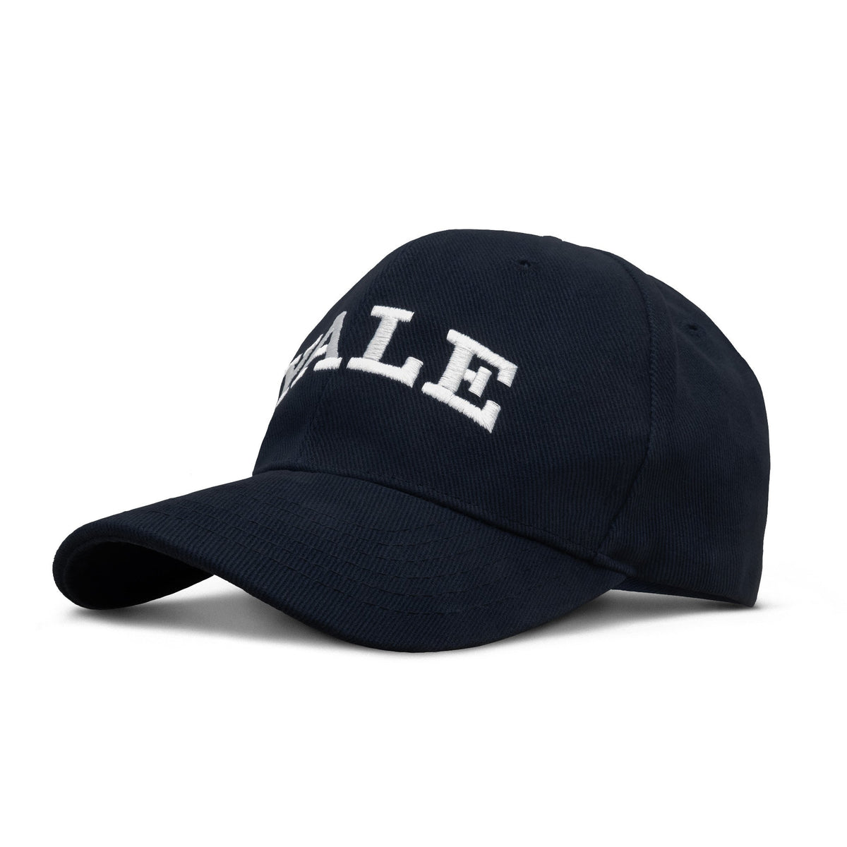 Navy baseball cap with arched white YALE lettering on front, curved brim.
