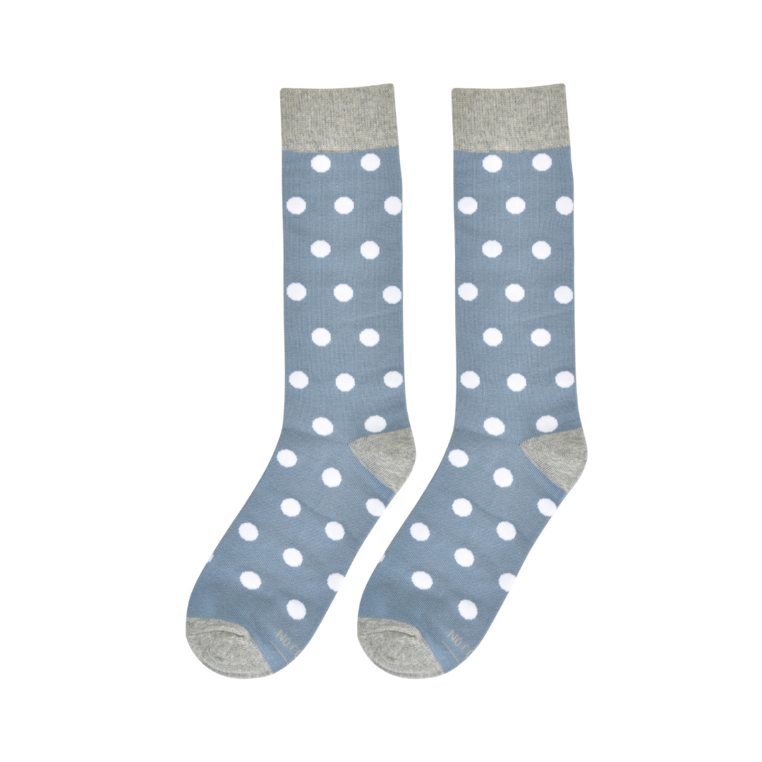 Pair of dusty blue crew socks with white polka dots and gray heels, toes, and cuffs