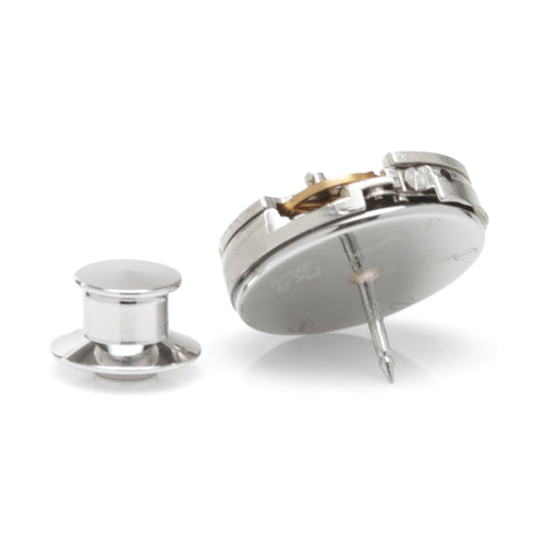 Round silver watch movement lapel pin with pin backing and post.