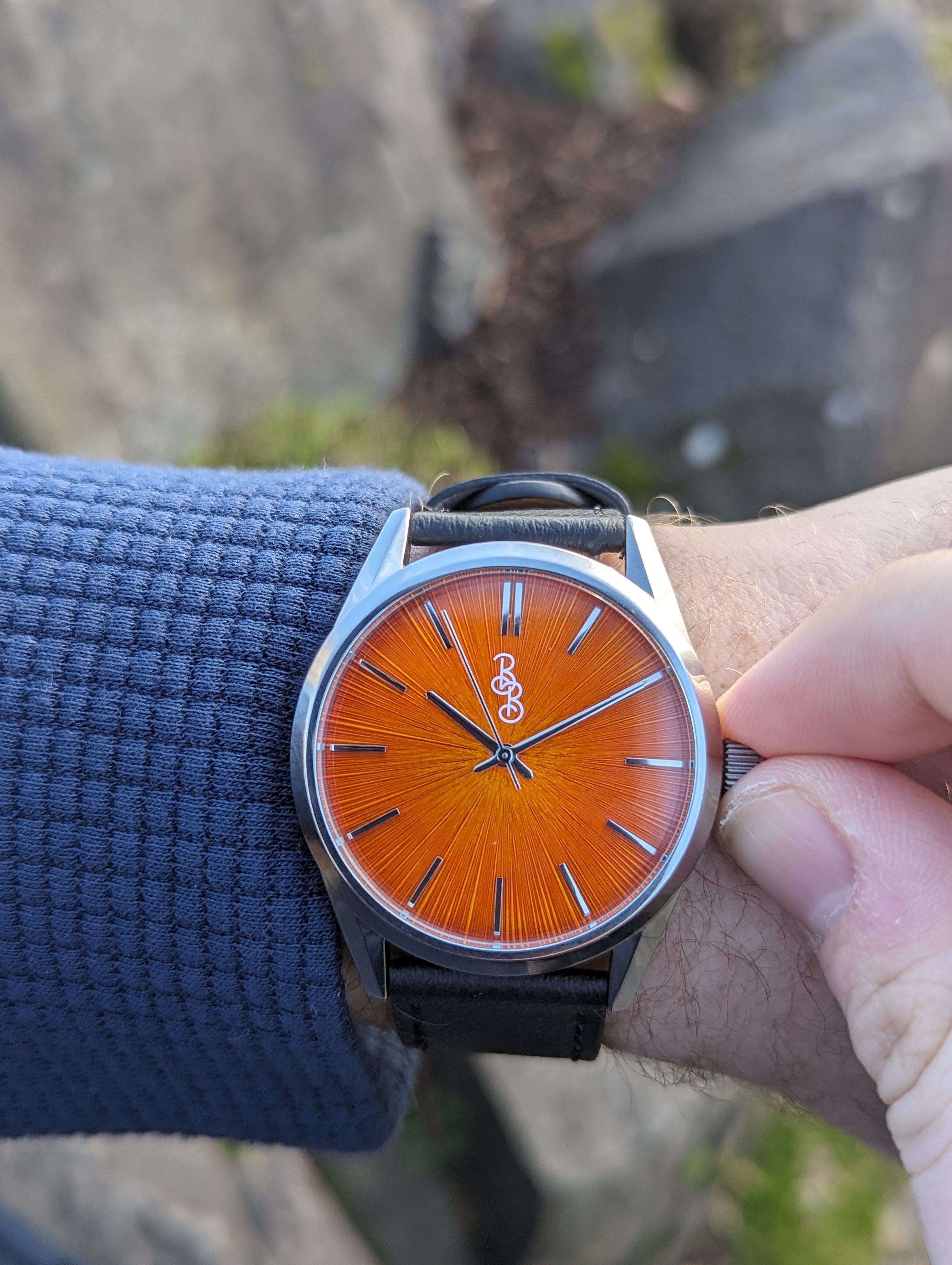 Orange Sunburst Watch - lifestyle view