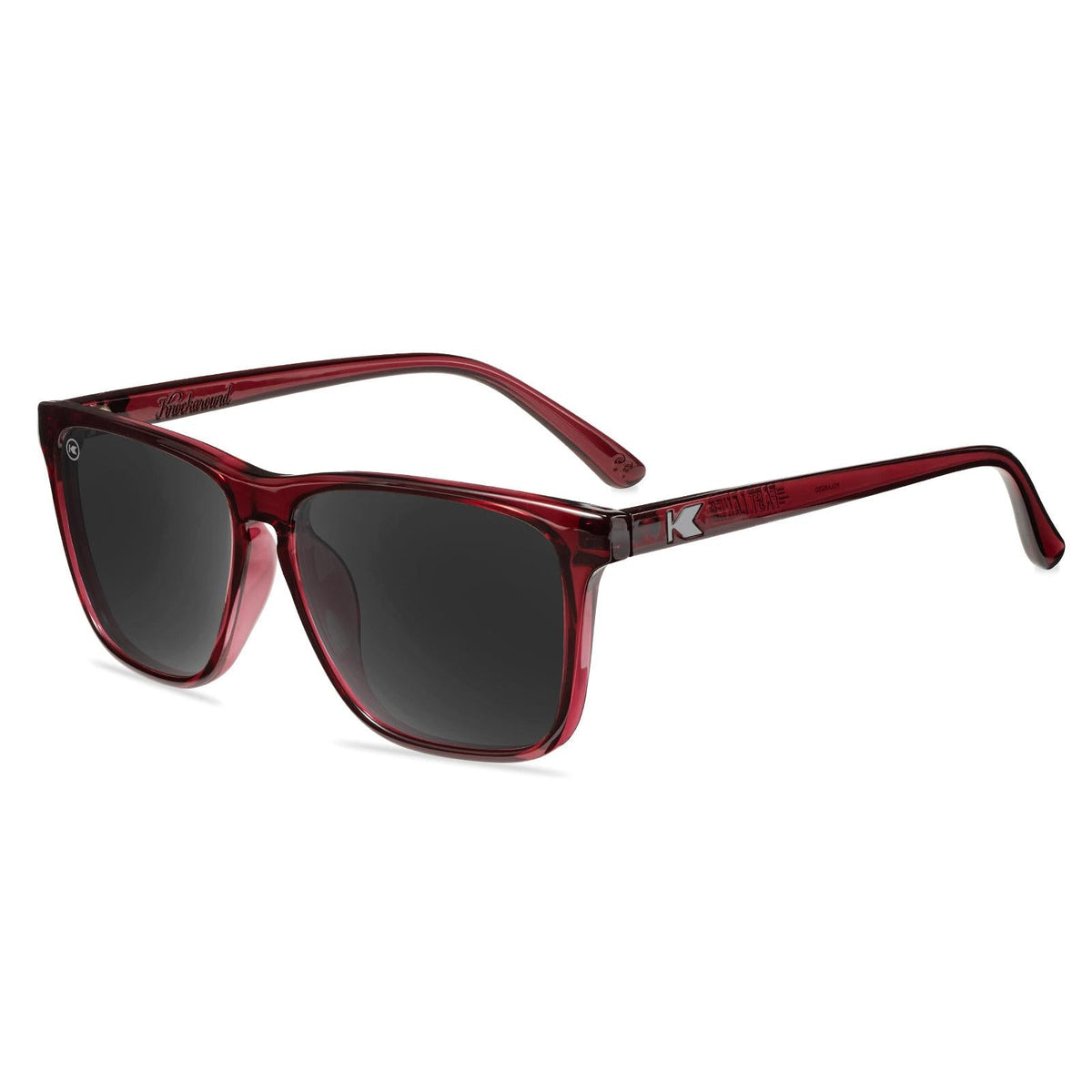 Burgundy sunglasses with dark gray lenses and red frame arms