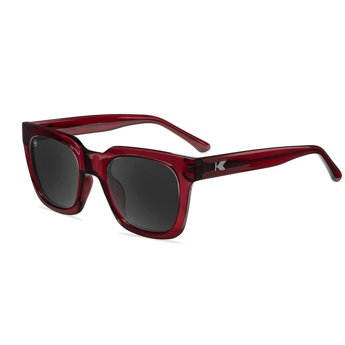 Burgundy square sunglasses with dark tinted lenses and curved temples