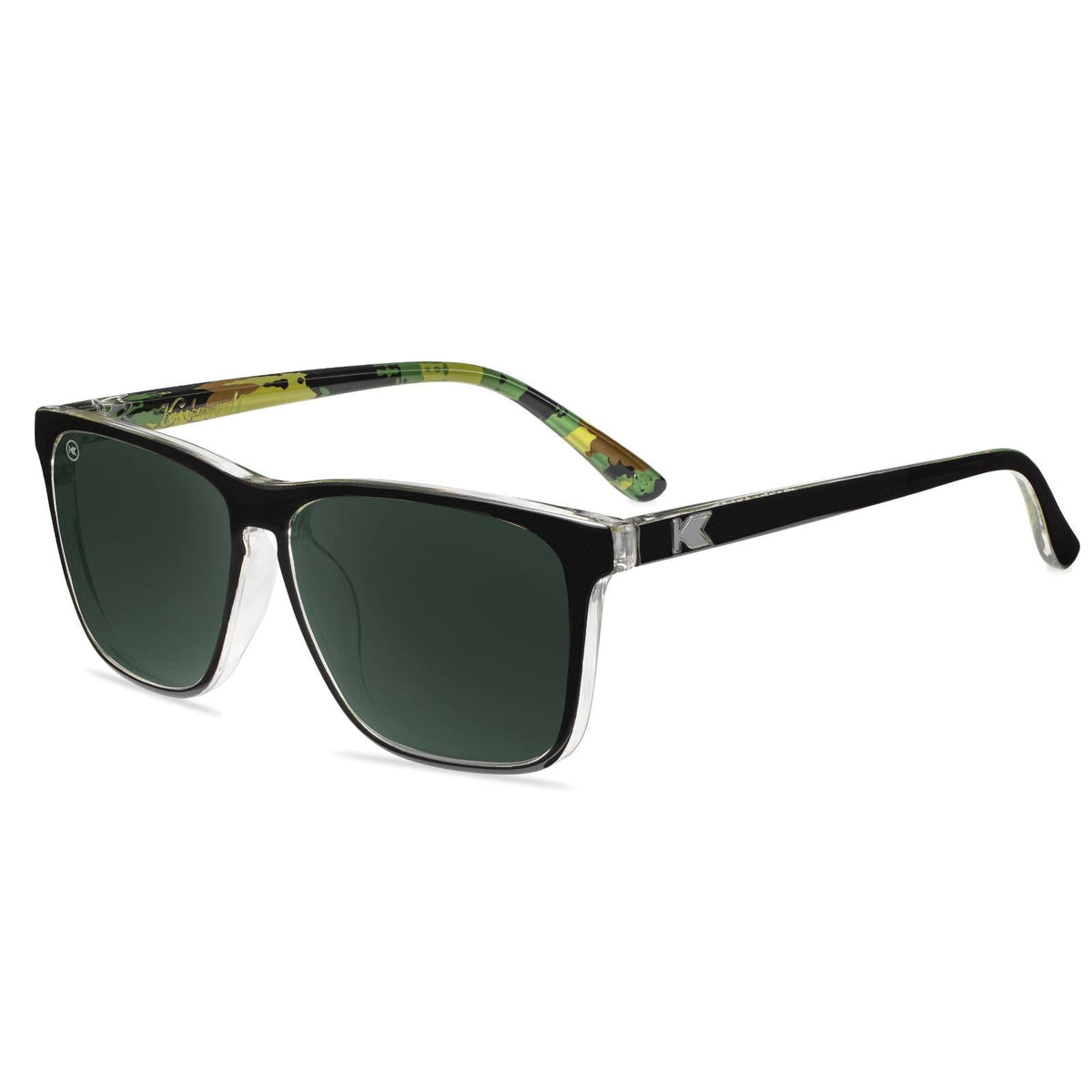 Black sunglasses with green patterned frame arms and dark green lenses
