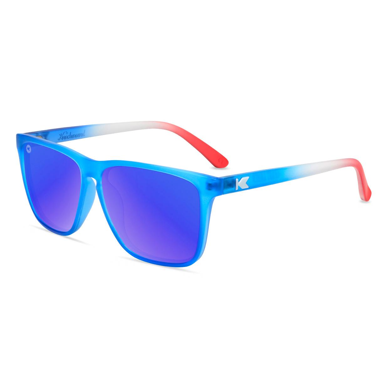 Square sunglasses with blue frames, red arms, and blue mirrored lenses.