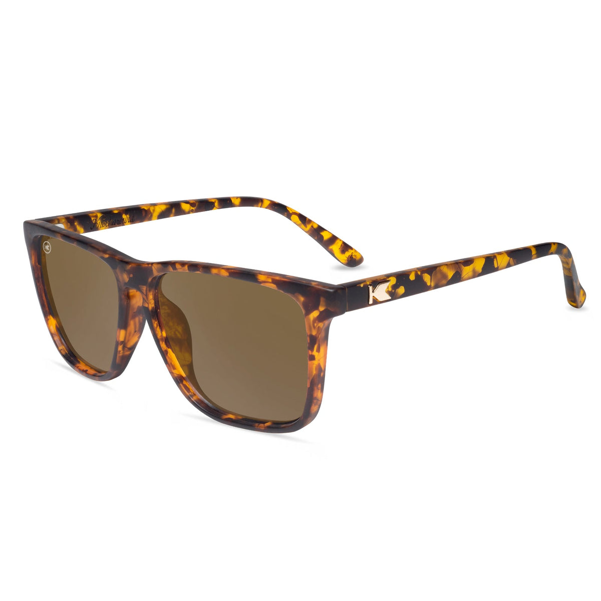 Square sunglasses with tortoise frames and amber tinted lenses.