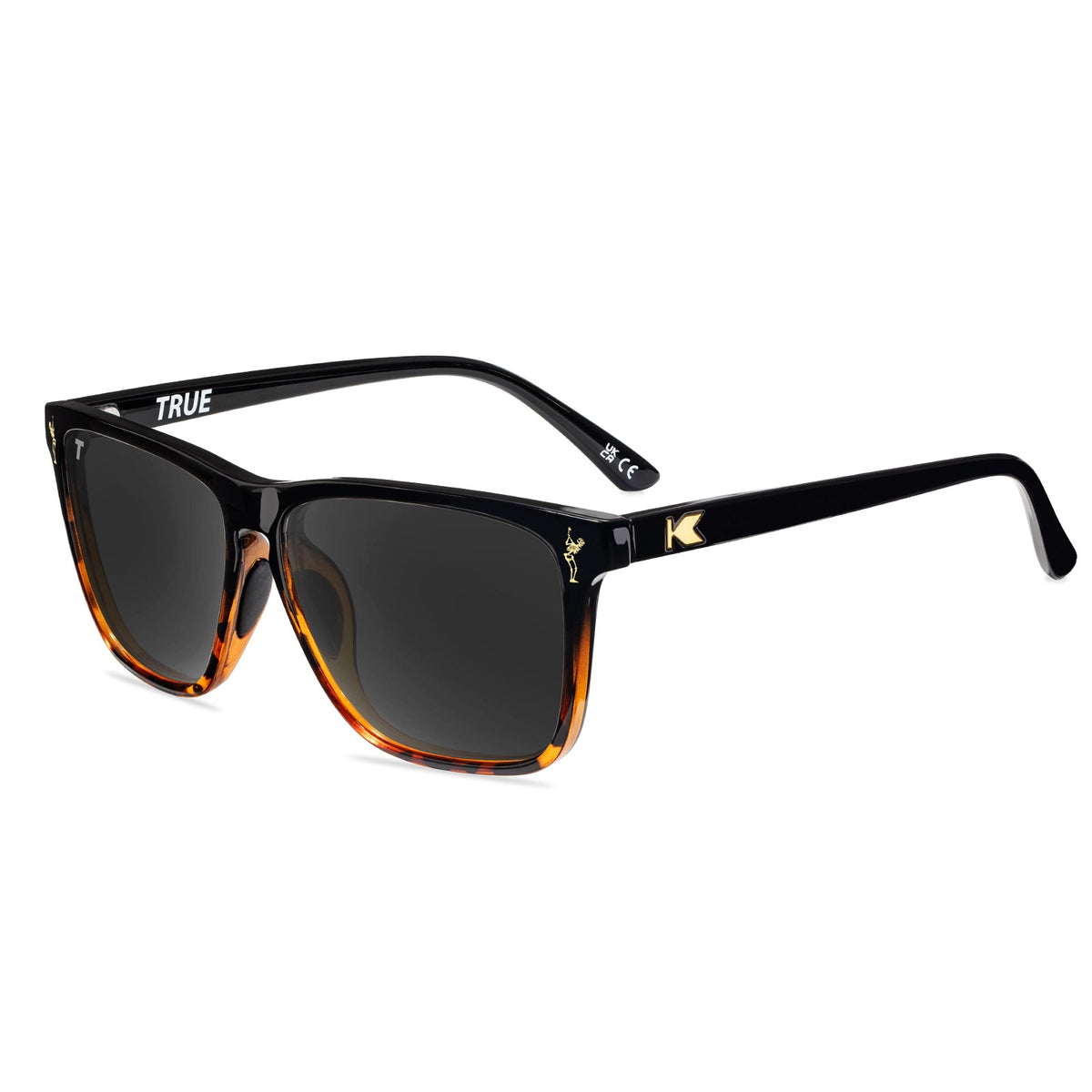 Black sunglasses with dark lenses and amber-tinted side temples