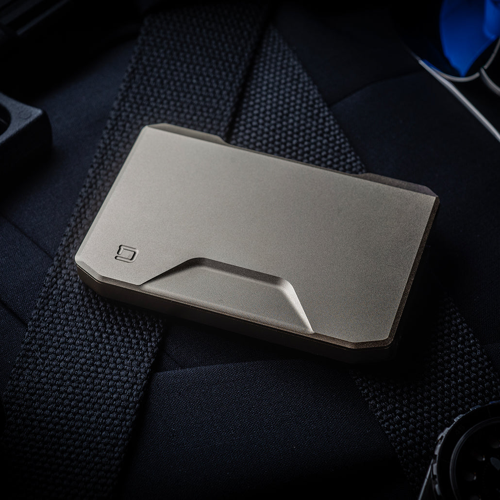 Dango SK1 Slide Kick Wallet in satin silver, shown closed with sculpted front panel