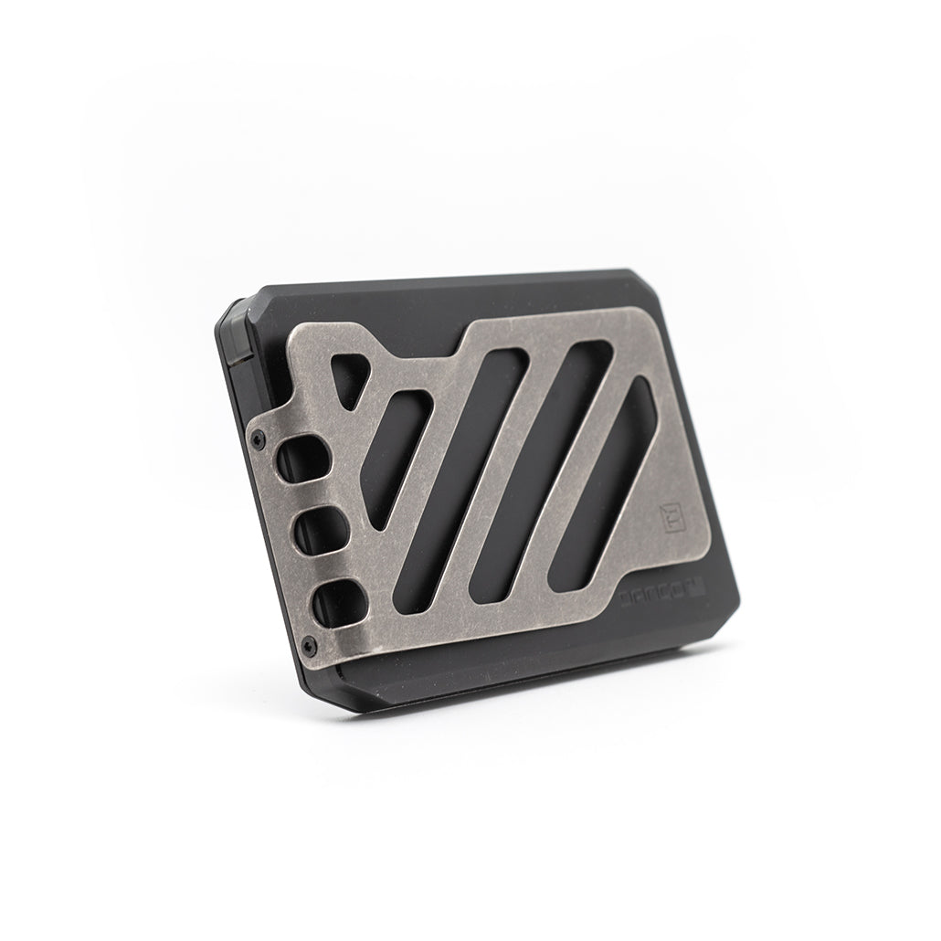 Jet black slide-kick wallet with metal money clip and diagonal stripe cutout pattern