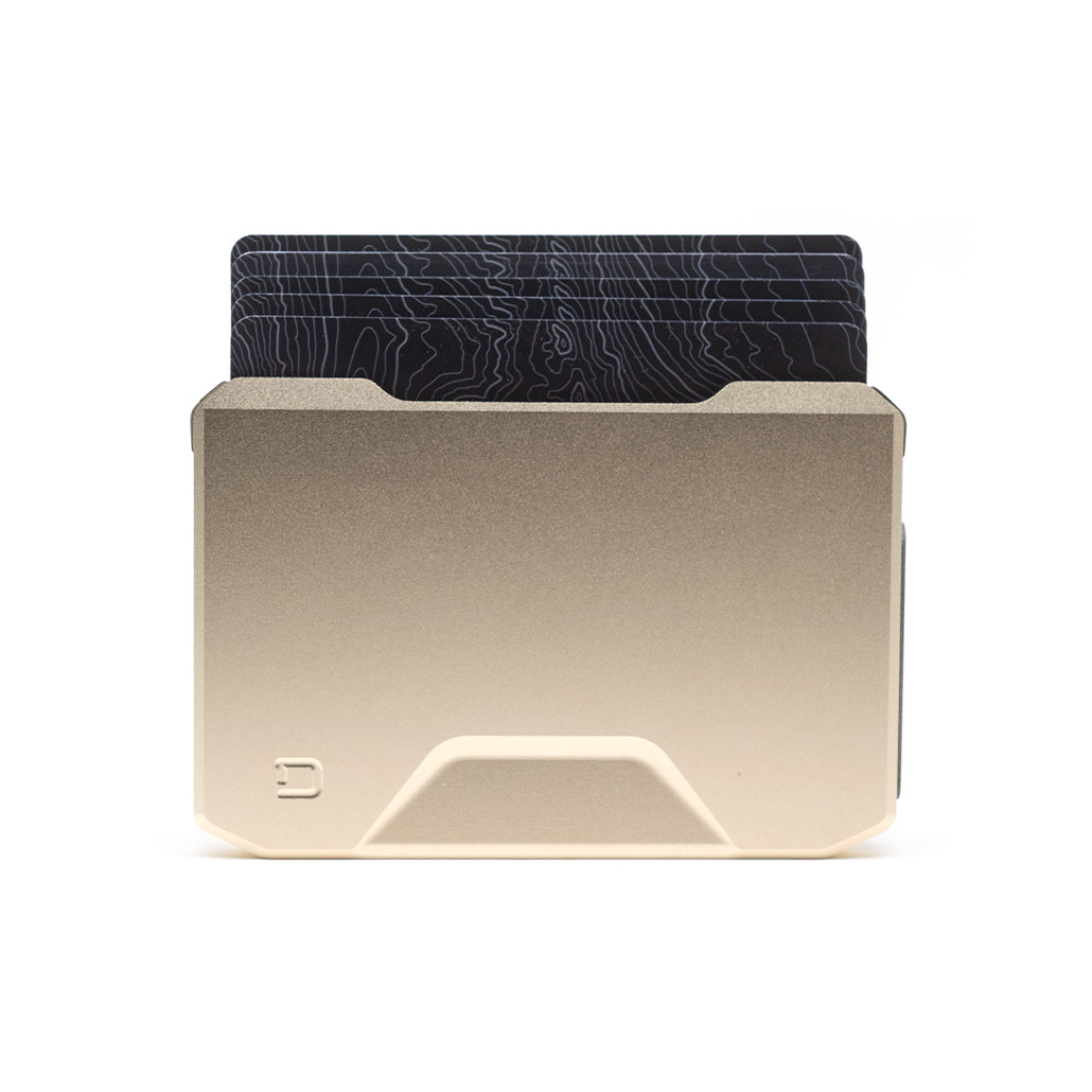 Champagne gold slide kick wallet with black textured card cover, front view